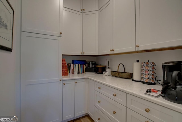 kitchen with white cabinets and light countertops