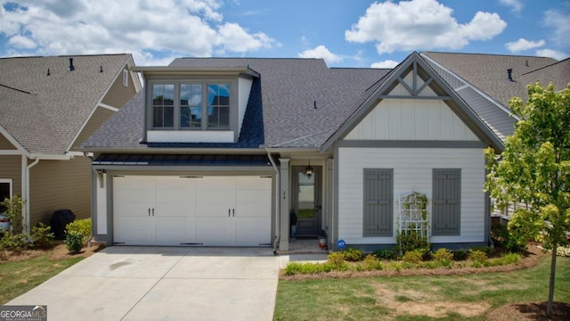 craftsman-style home with concrete driveway, roof with shingles, board and batten siding, and a garage