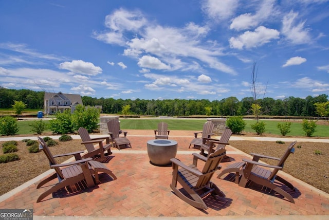 view of patio / terrace featuring a fire pit