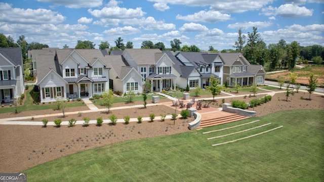 exterior space with a residential view and a lawn