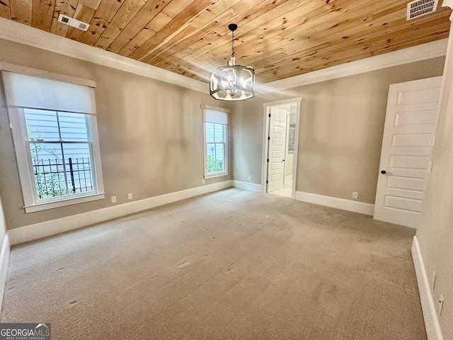 empty room featuring an inviting chandelier, carpet flooring, visible vents, and wooden ceiling