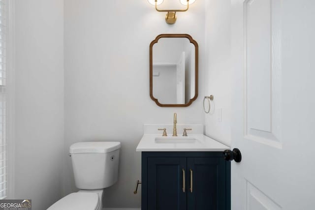 bathroom with vanity and toilet