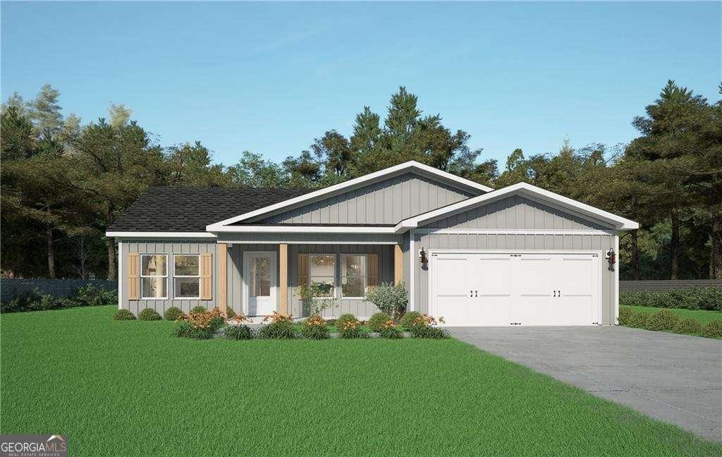 view of front of home with a porch, a garage, and a front yard