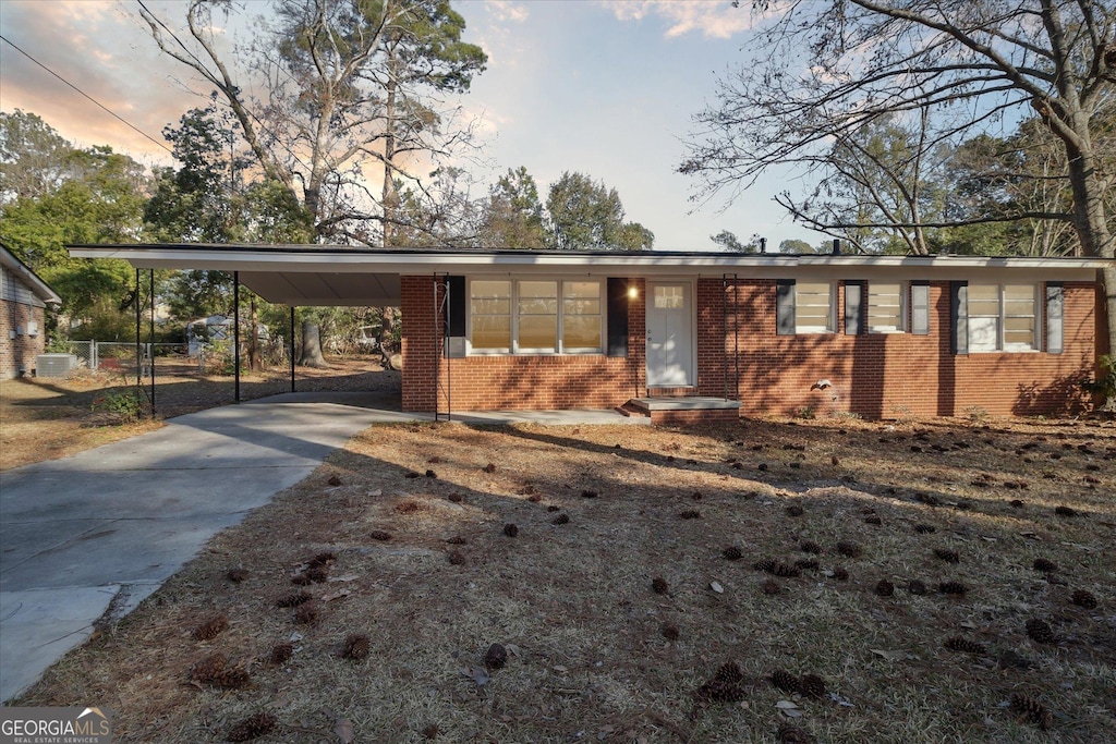 view of front of property with a carport