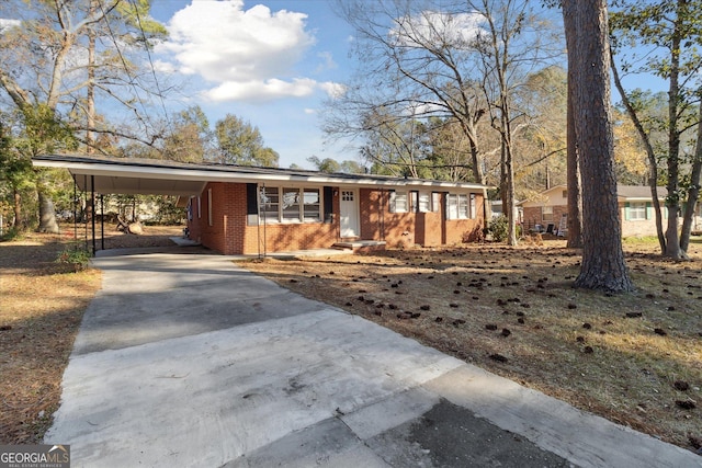 ranch-style home featuring a carport