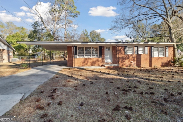 ranch-style house with a carport