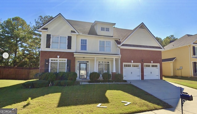 view of front of property with a garage and a front lawn