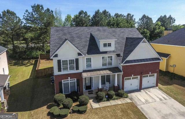 view of front of house with a garage and a front yard