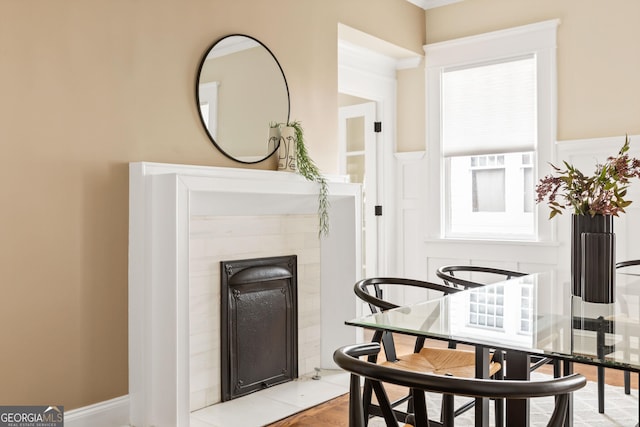 dining area with a tile fireplace