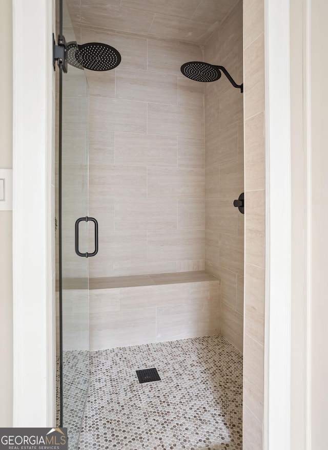 full bathroom featuring a stall shower