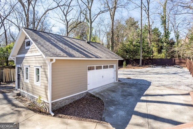 detached garage with fence