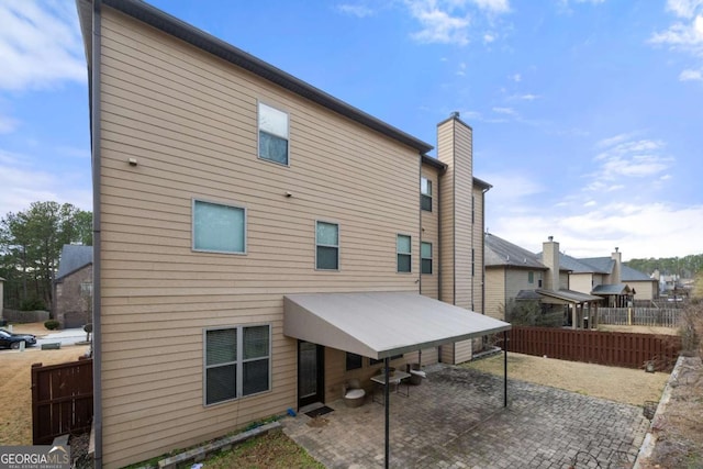 rear view of property with a patio area