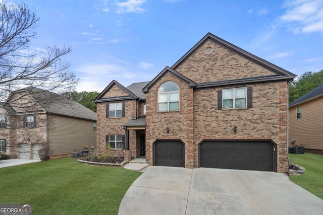 view of front of property featuring a garage and a front yard