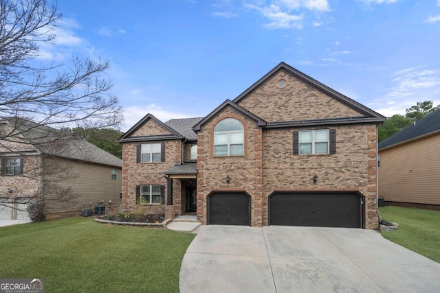 view of front of house featuring a garage and a front yard