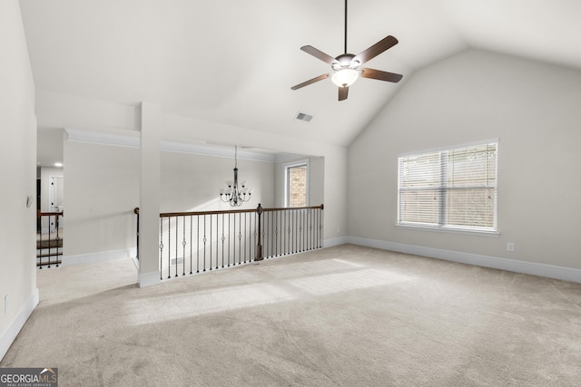 2268 Austin Common Way, Dacula, GA 30019 - carpeted spare room featuring visible vents, baseboards, high vaulted ceiling, and ceiling fan with notable chandelier