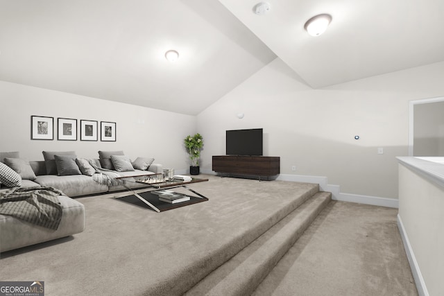 2268 Austin Common Way, Dacula, GA 30019 - living area featuring light carpet, baseboards, and lofted ceiling
