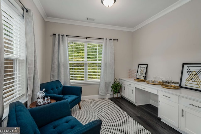 interior space with crown molding, dark hardwood / wood-style floors, and built in desk