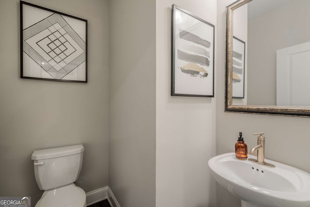 bathroom with sink and toilet