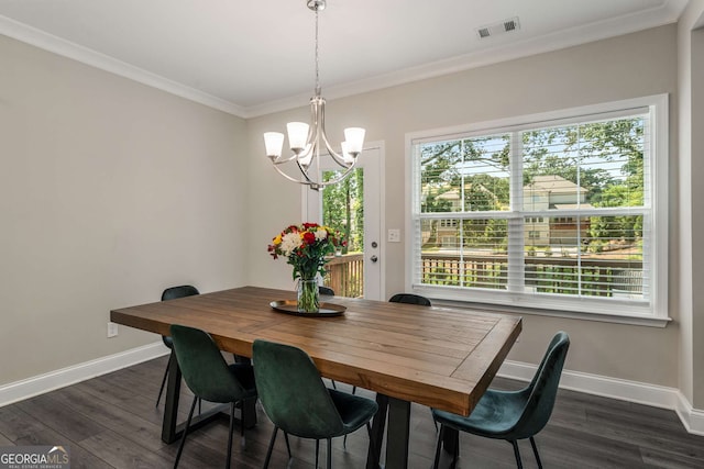 dining space with crown molding, dark hardwood / wood-style floors, and a notable chandelier