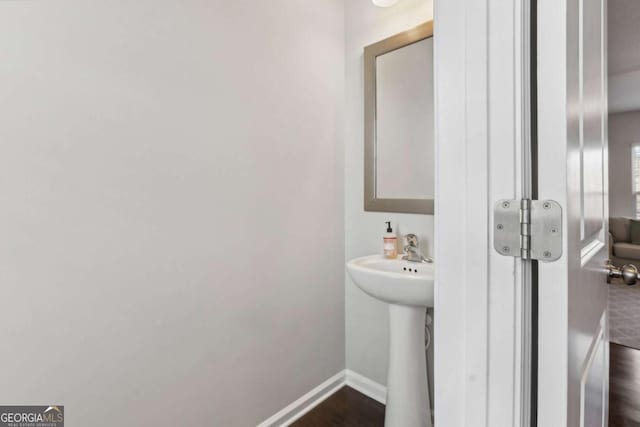 bathroom featuring hardwood / wood-style flooring and sink