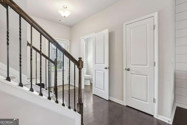 stairs with hardwood / wood-style floors