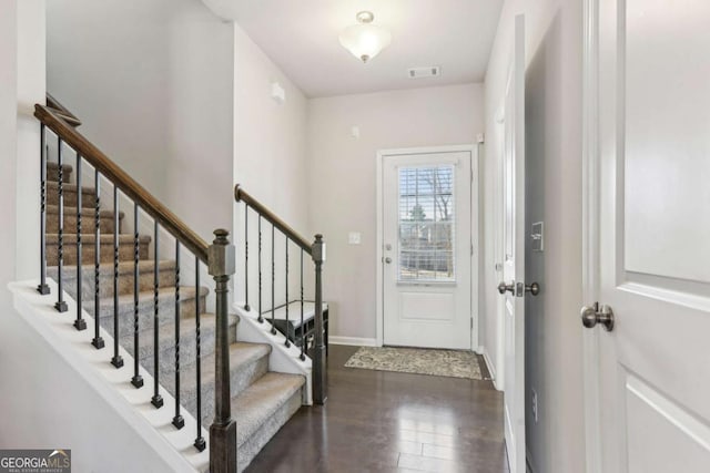 foyer entrance with dark hardwood / wood-style flooring