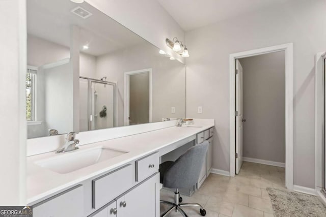 bathroom with tile patterned flooring, vanity, and an enclosed shower