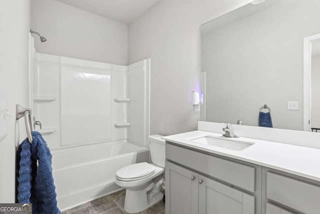 full bathroom with vanity, washtub / shower combination, and toilet