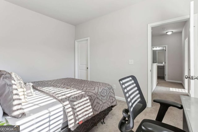 bedroom with light colored carpet