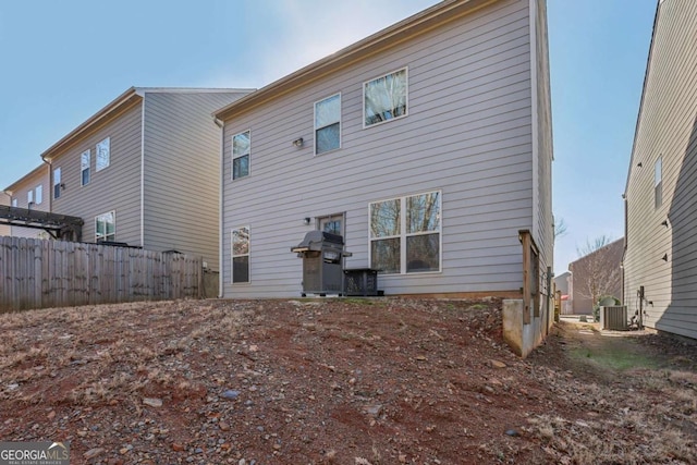 rear view of property with central air condition unit