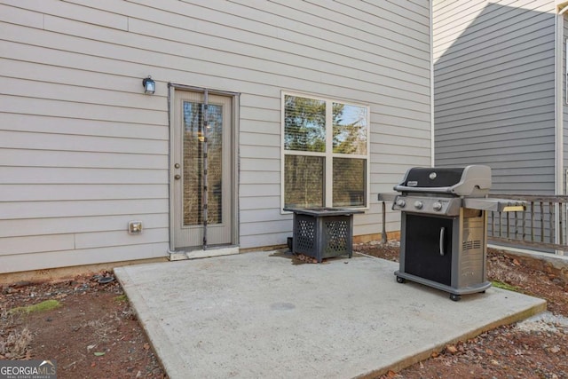 view of patio featuring a grill