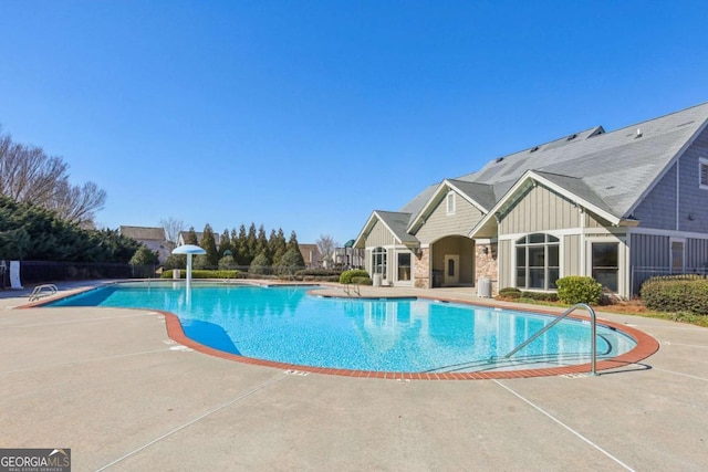 view of swimming pool with a patio