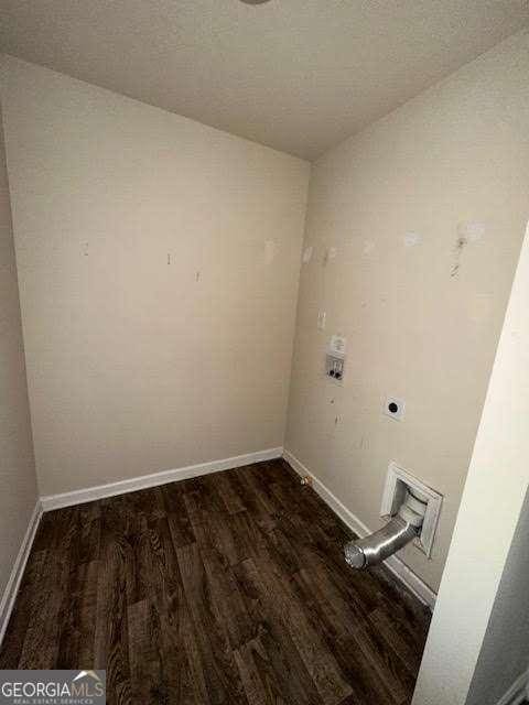 washroom with washer hookup, hookup for an electric dryer, and dark hardwood / wood-style flooring