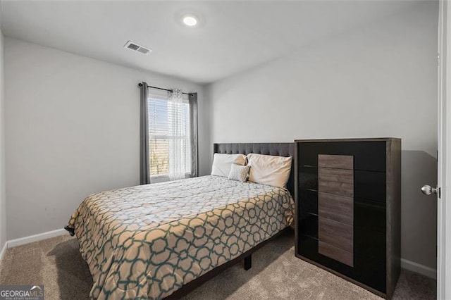 bedroom with light colored carpet