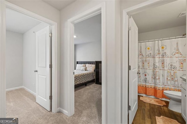 bathroom featuring toilet and walk in shower