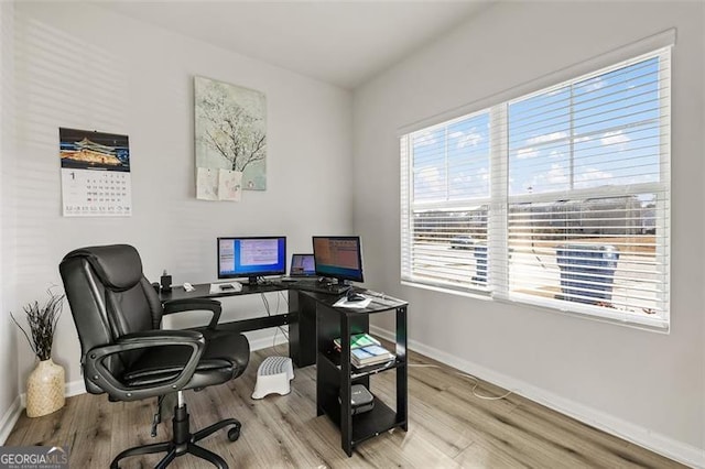 home office featuring light hardwood / wood-style floors