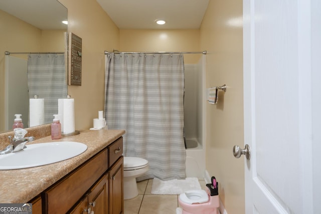 bathroom featuring a shower with curtain, vanity, tile patterned floors, and toilet