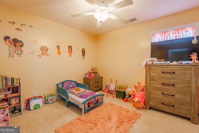 bedroom featuring ceiling fan and light carpet