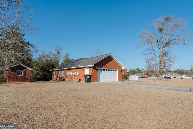 view of home's exterior featuring a garage and an outbuilding