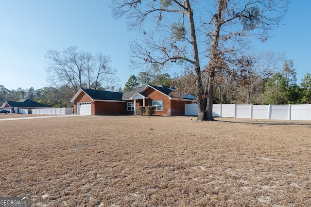 view of front of property with a garage