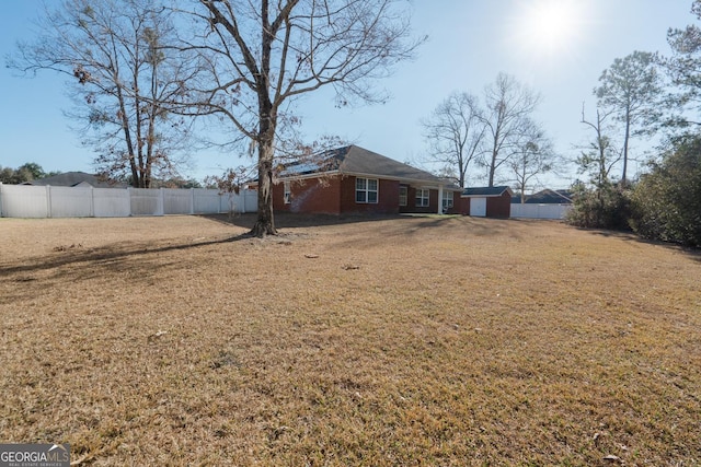 view of yard with a storage shed