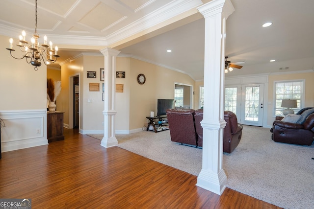 living room with carpet floors, ceiling fan, ornamental molding, and decorative columns