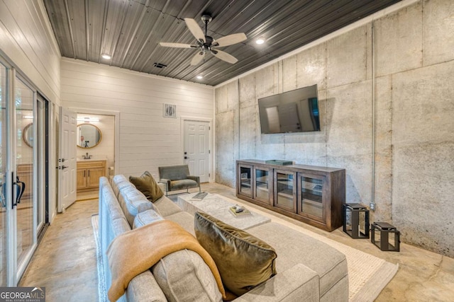 living room with sink, wood ceiling, and ceiling fan