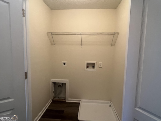 washroom featuring washer hookup, dark hardwood / wood-style flooring, and hookup for an electric dryer