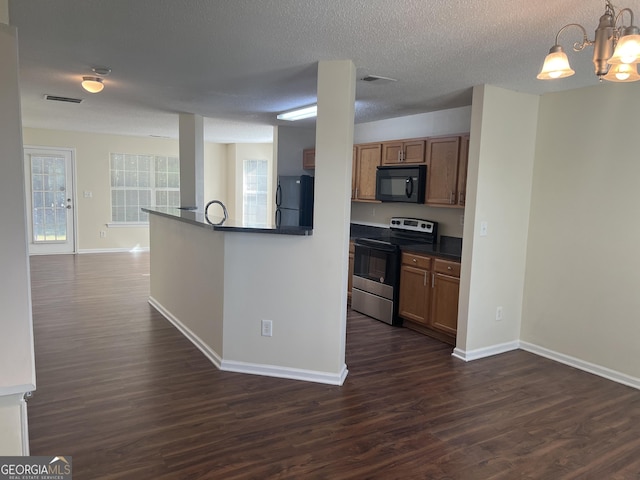 kitchen with refrigerator, pendant lighting, dark hardwood / wood-style flooring, and stainless steel electric range oven