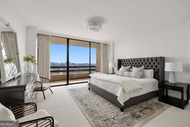 bedroom featuring a wall of windows, access to outside, ornamental molding, and carpet