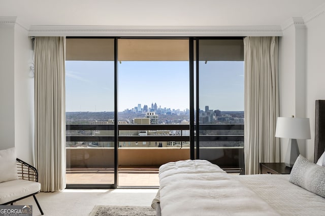 carpeted bedroom with a city view and crown molding