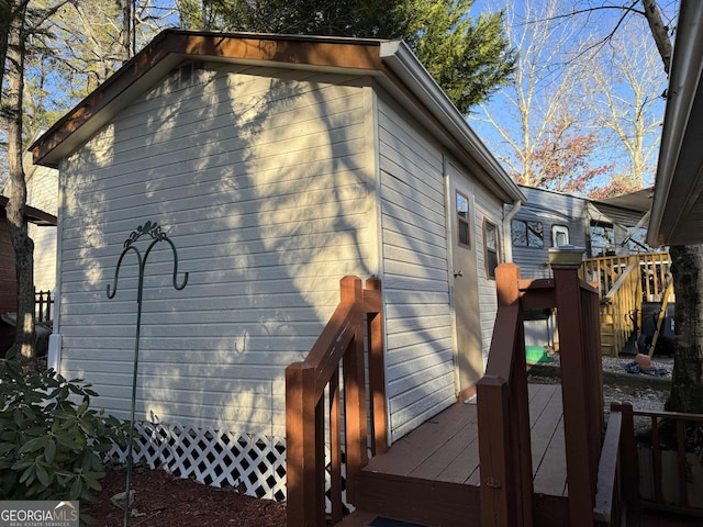 view of side of property with a wooden deck