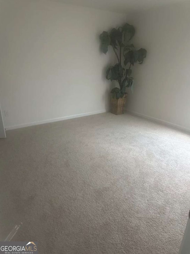 empty room with carpet flooring