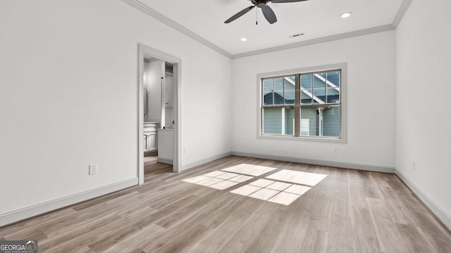 unfurnished room featuring ceiling fan, ornamental molding, and light hardwood / wood-style flooring